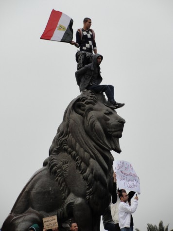 Protestors mount a statue in Tahrir Square as demonstrations against Mubaraks presidency continue. PENELOPE SHEPHERD/THE CAMPUS