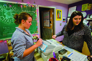 Grounds for Change volunteer Ashley O’Donnell, ’12 serves Alivia Haibach, ’13 on Thursday night.  Members of the the GFC board are working with Parkhurst to take steps toward designating Allegheny a “fair trade college.”  Although many of GFC’s products are Certified Fair Trade, it is not yet considered a fair trade institution. CODY MILLER/THE CAMPUS