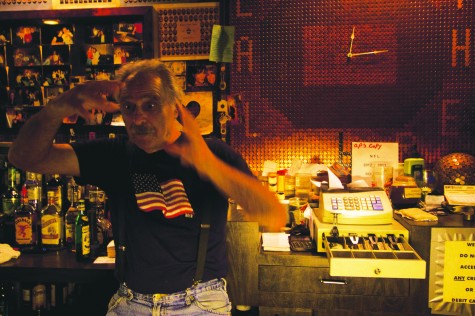 Jimmy Fucci, founder of The Other Place (The Penny Bar), stands behind his bar, which he built himself. After 39 years of owning The Other Place, Fucci retired at the end of 2012, selling the rights to another local bar owner.