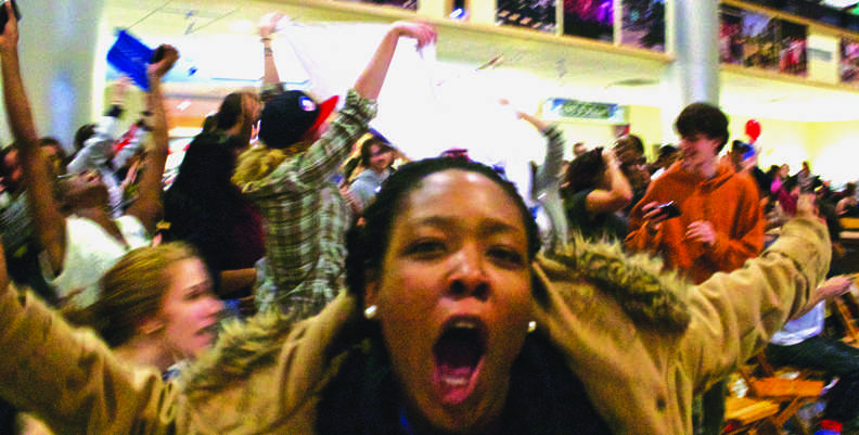 Taisha Thomas, ’13, celebrates as President Barack Obama wins a second term. Students gathered in the Campus Center for an Election Day party put on by the Center for Political Participation. CAITIE MCMEKIN/THE CAMPUS
