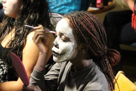 Maya Jones, 15, paints a skull design on her face in celebration of the Mexican holiday Día de los Muertos. Photo credit: Stefano Wach