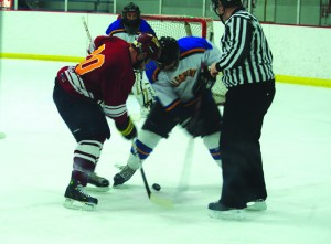 Junior forward Andrew Greiner takes a faceoff during a game against Gannon University on Feb. 22, 2013. The Gators lost