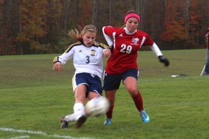 Jessie Thiessen, 2017, battles for the ball against a Hiram player during the NCAC match at Robertson Athletic Complex on October 23, 2013.  Later in the second half, Thiessen scored the Gator's second goal, bringing them closer to their fifth straight shutout.  Katie McMekin/THE CAMPUS