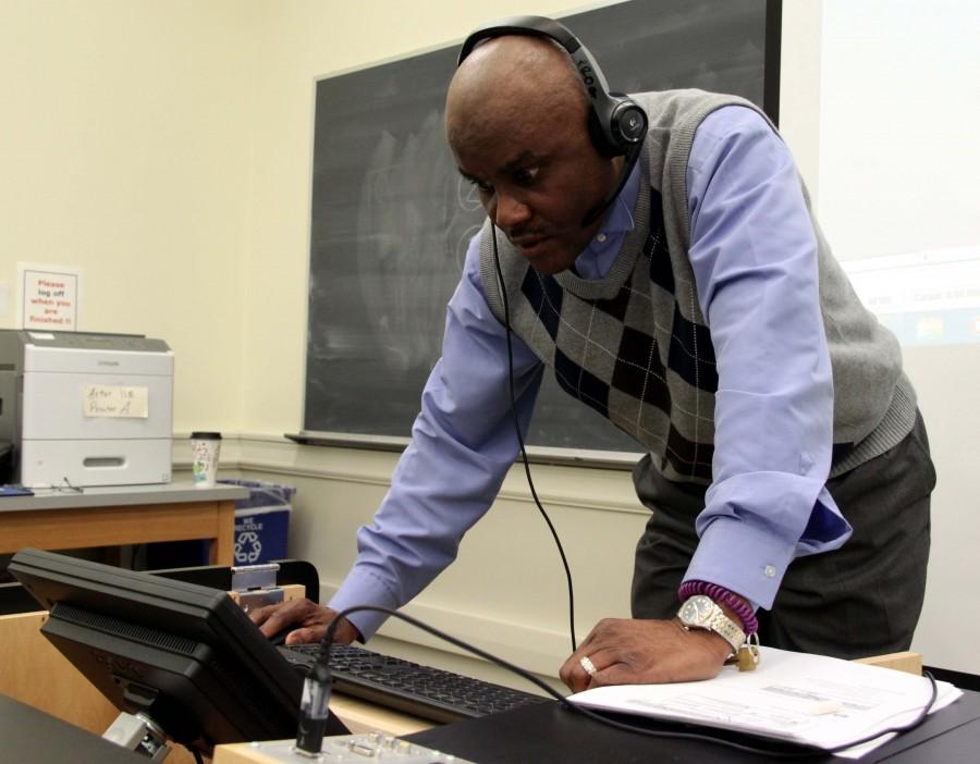 MEGHAN HAYMAN/THE CAMPUS Cyril Ibe, communications professor at Central State University and well known radio broadcaster, prepares to demonstrate how to collect soundbites to the multimedia class on Feb. 19.