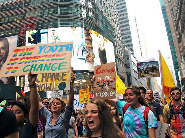 Members of Students for Environmental Action from Allegheny College, (from left to right) Amanda Sandor, 16, Courtney James, 18, and Katy Click, 16, participate in the Peoples Climate March in New York City on Sept. 21, 2014.