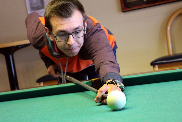 Ryan Tipker, ‘18, aims the cue during a daytime visit to the game room. Pool is one of the most popular games amongst students and faculty alike.