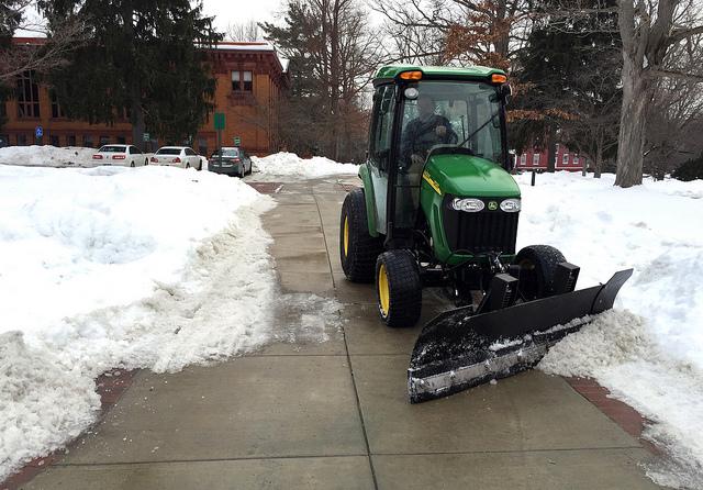 Physical plant continues to clear pathway on Wednesday, Feb. 11 following heavy snowfall the previous week. 