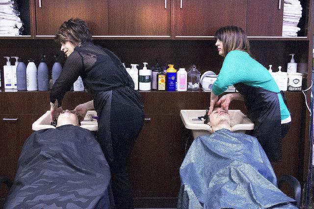 Sydney Killburn and Crystal Ferry wash their clients hair in Cathys Beauty Salon on a Friday afternoon, March 6th. 