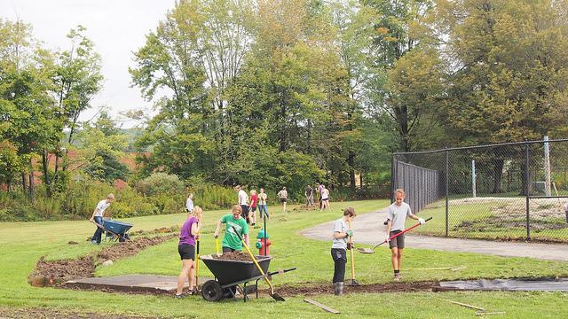 Allegheny College students dig and outline the footpath from the Meadville Area High School to the Meadville Area Recreation Complex on Saturday, Sept 19, 2015.