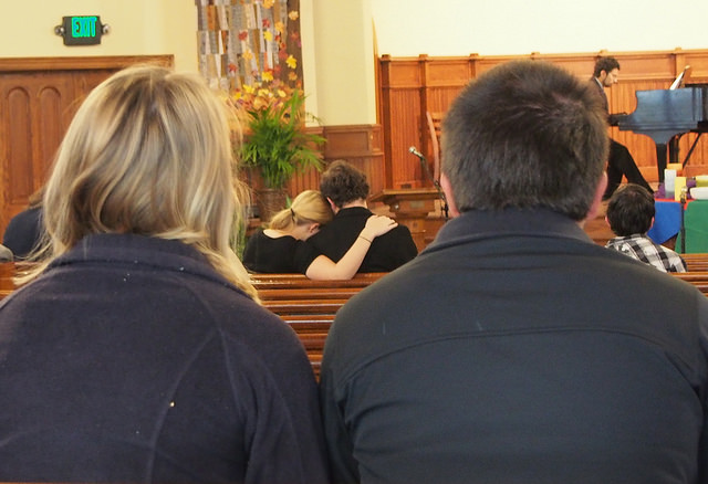 Chloe Carter, ’18, the former roommate of Hannah Morris leans for comfort on the shoulder of Troy Dinga, ’17, during the memorial in Ford Chapel on Saturday, Nov. 14, 2015.