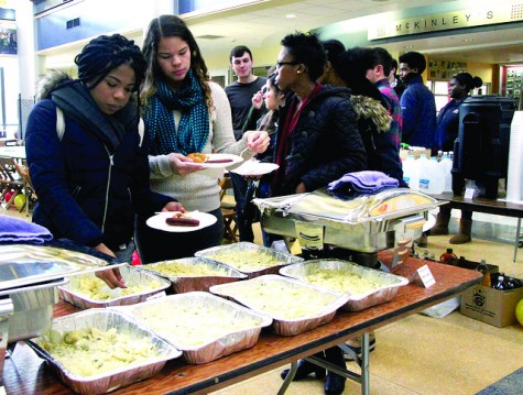 Students eat potato salad, sausages and pretzels at the event on Thursday, Feb. 18, 2016 in the campus center.