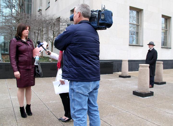 Kirk Nesset's attorney, Meagan Temple, speaks with the news outside of the Federal District Court building following the sentencing of the former Allegheny College professor on Feb. 8, 2016