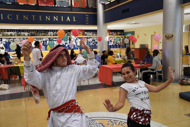 Noah Dawgiello, ’19, and Natali Salaytah, ’19, dance during the celebration of Eid al-Adha in the campus center lobby on Sunday, Sept. 25, 2016.