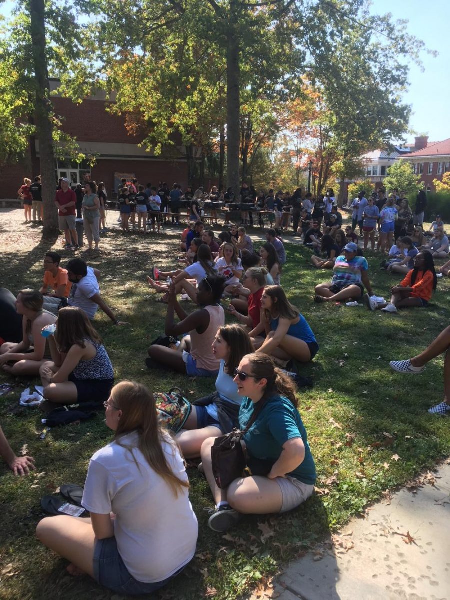 Members of the Allegheny community watch the wing-eating competition on the Gator Quad. 
