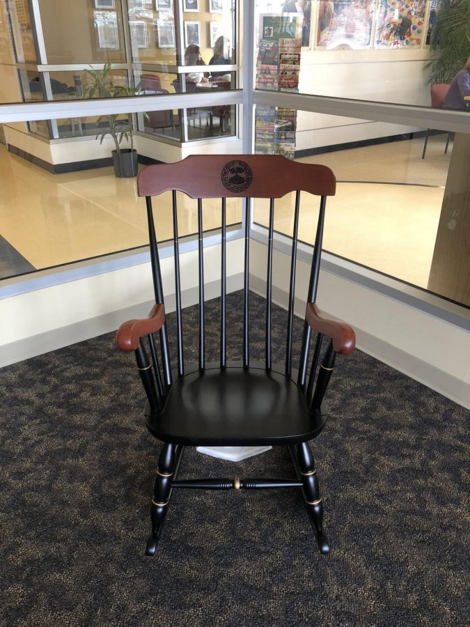 A chair with the phrase “be somebody who makes everybody feel like a somebody” on the back, dedicated to the memory of Pamela McCurdy is displayed on Saturday, March 3, 2018.