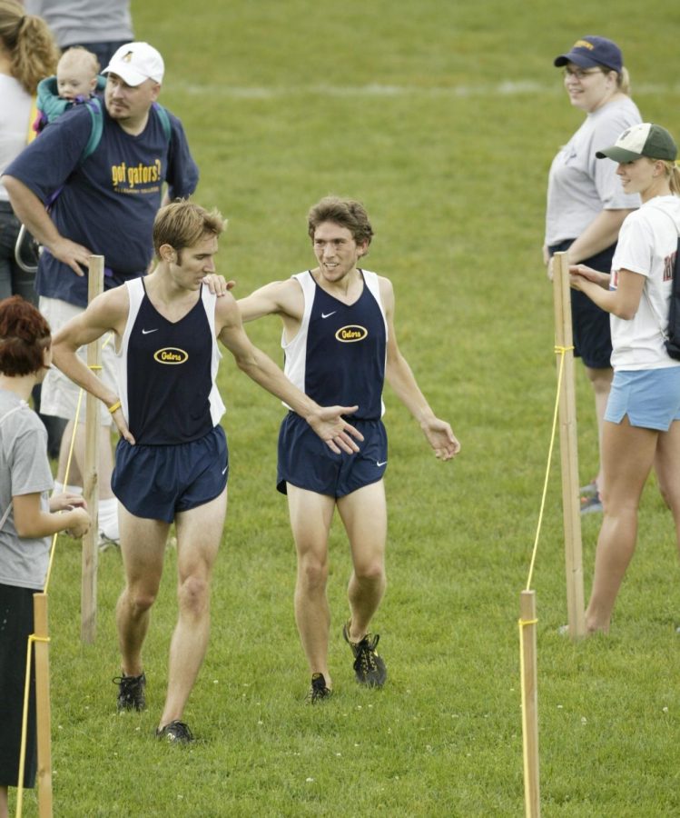 Now-coach Ben Mourer, ‘07, and former teammate Ryan Place walk through the finish chute after placing 1st and 2nd at the 2005 Allegheny XC Classic.