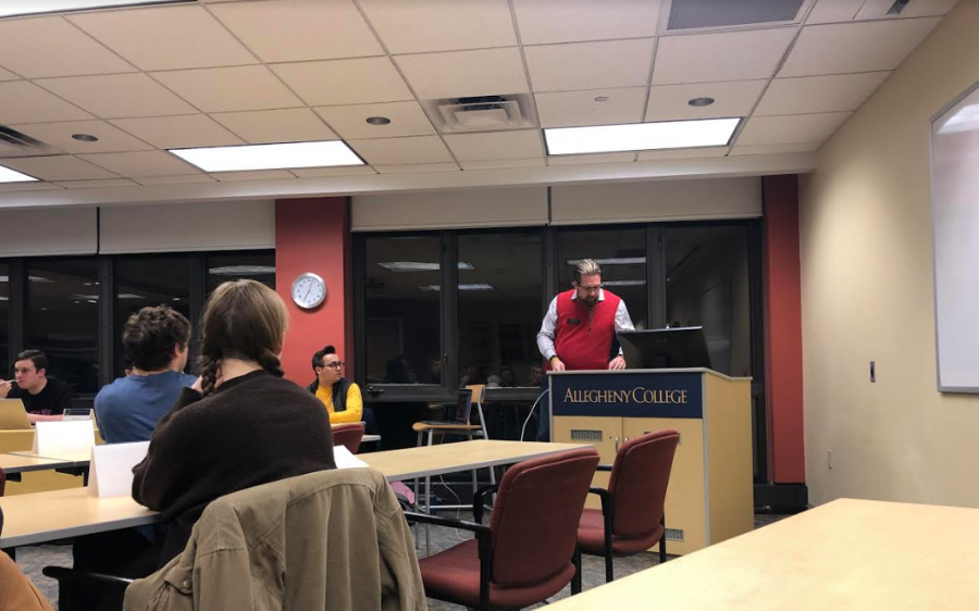 Registrar Ian Binnington speaks about changes to Allegheny College's daily grid schedule  during Allegheny Student Government's general assembly meeting Tuesday, March 5, in room 301/302 of the Henderson Campus Center.