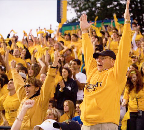 James and Mari Mullen cheer during an Allegheny College football game in 2010 at the Robertson Athletic Complex Football Stadium.