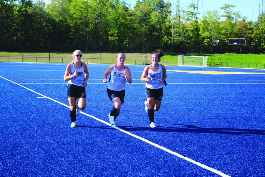 Allegheny College Women’s Field Hockey teammates Becca Winton, ‘23, Kinsley Greenlaw, ‘23, and Hannah Sharp, ‘23, run on Sept. 5, 2019 at Robertson Athletic Complex during practice.