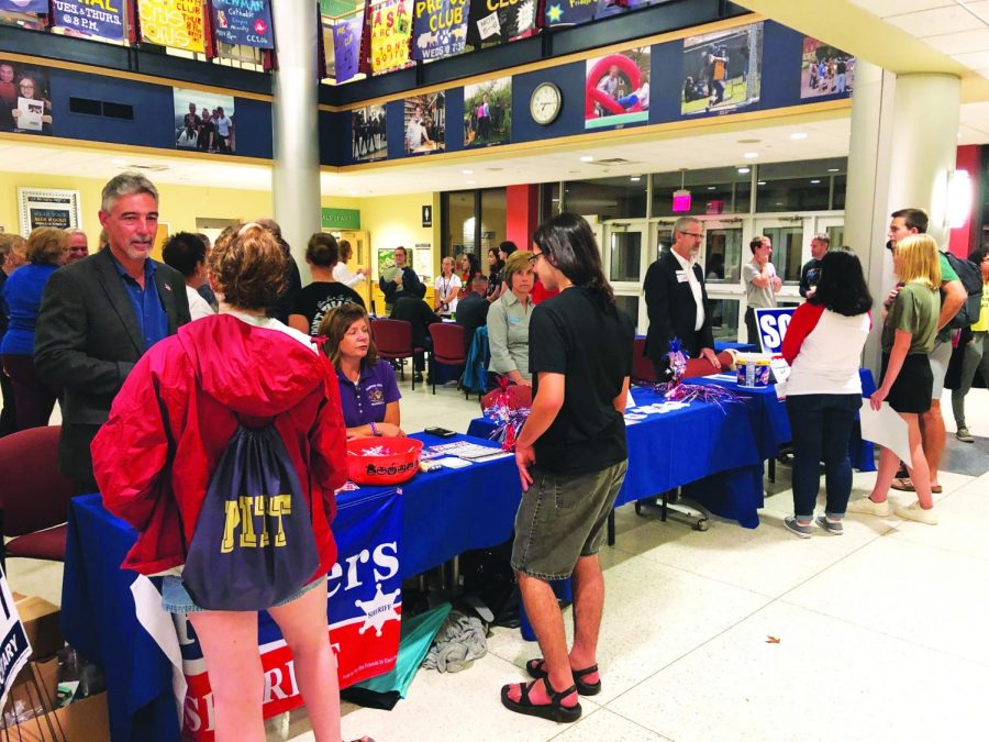 Students talk to local representatives at the local candidate forum on Wednesday, Oct. 2, 2019, in the Henderson Campus Center.