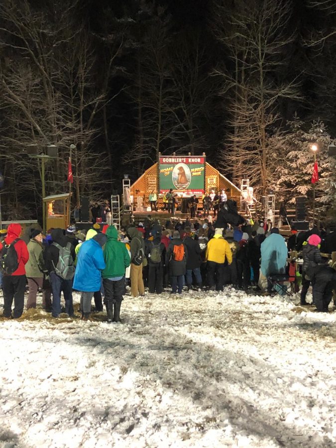 The crowd celebrating Groundhog Day gathers around the stage on which various musical guests perform on Feb. 2, 2020, in Punxsutawney.
