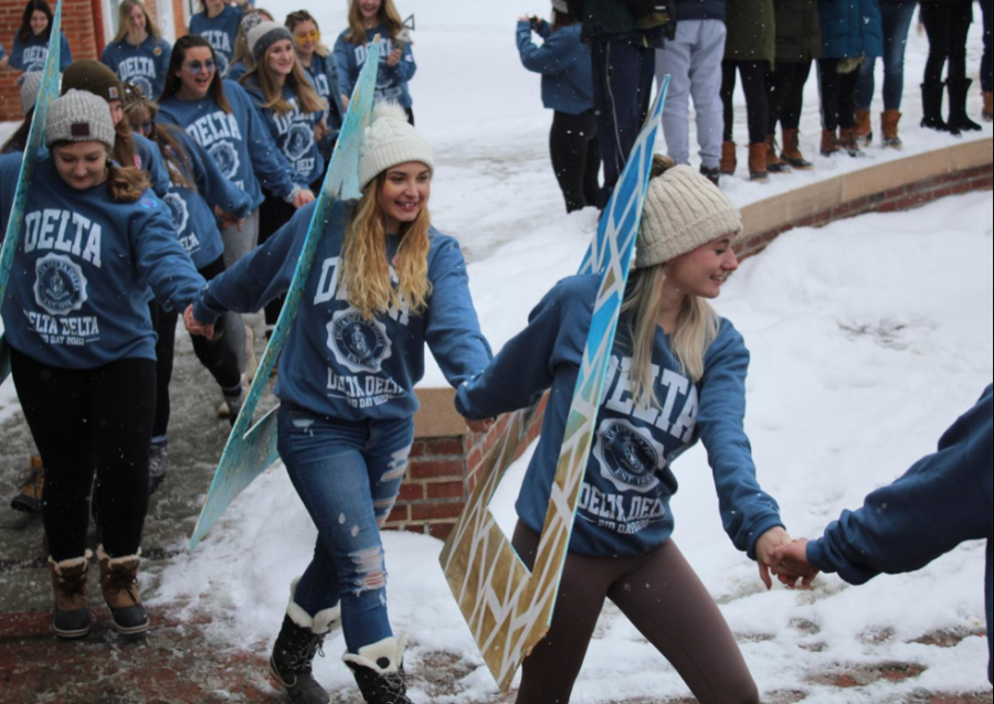 Sisters of Delta Delta Delta carry their letters on Sunday, Jan. 19, 2020, into Brooks Circle.