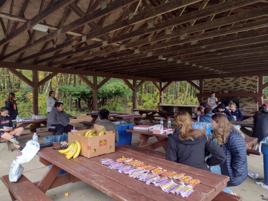 The participants from Allegheny’s first Up ‘til Dawn 5K on Sunday, Oct. 24 munch on some post-race snacks after going through the cross country course on Robertson Athletic Complex.