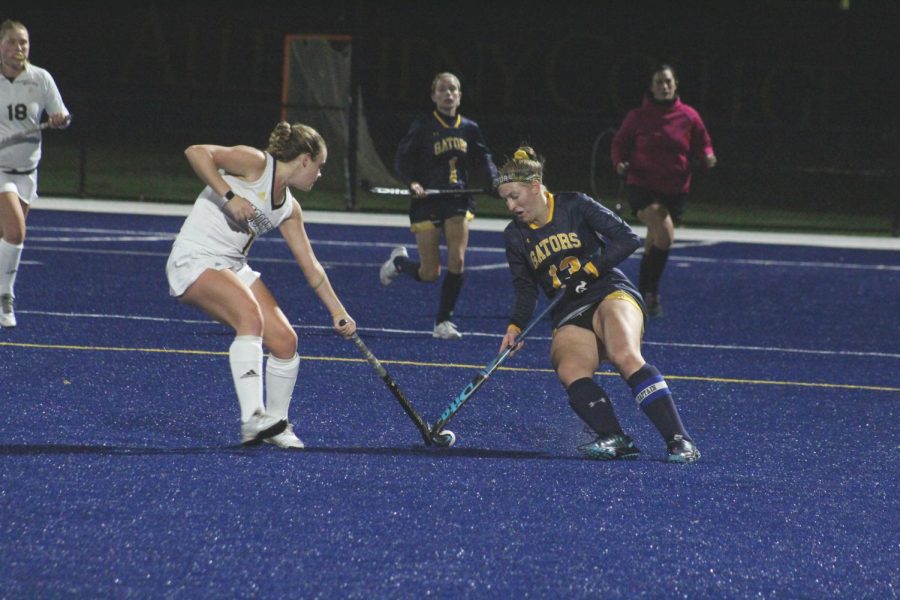 Becca Winton, ’23 clashes with a player from Wooster. Allegheny won Tuesday’s contest 3-2.
