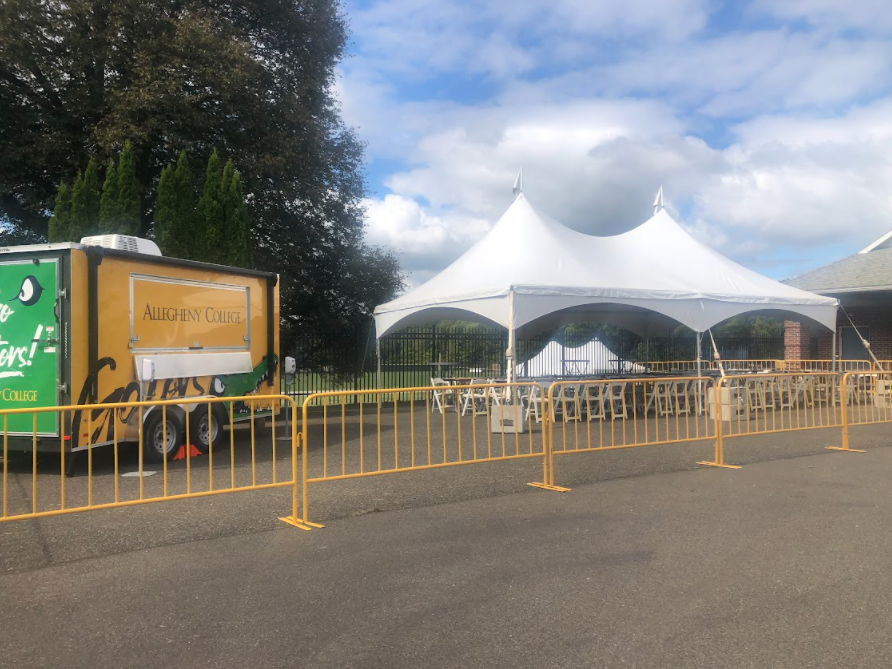 The truck and the designated area for alcoholic beverages are located inside the football stadium. Fans can stop at the truck on their way to the home seating section. 