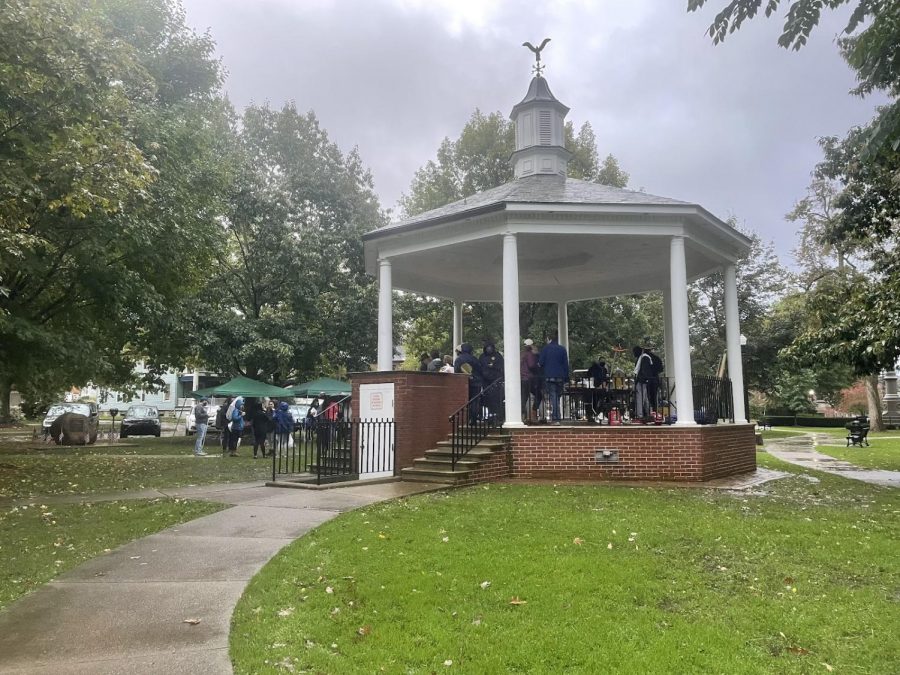 Members of the greater Meadville community gather under and around the gazebo in Diamond Park on Oct. 16 prior to volunteering.