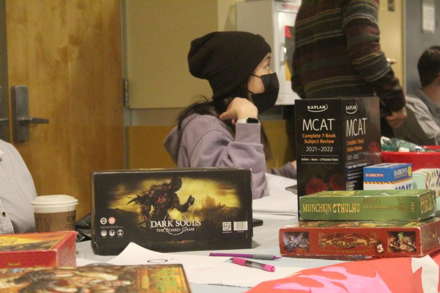 A “Dark Souls” board game sits at the Allegheny Role-playing and Gaming Organization table next to an MCAT study kit on display at the Allegheny Pre-Health Club table.