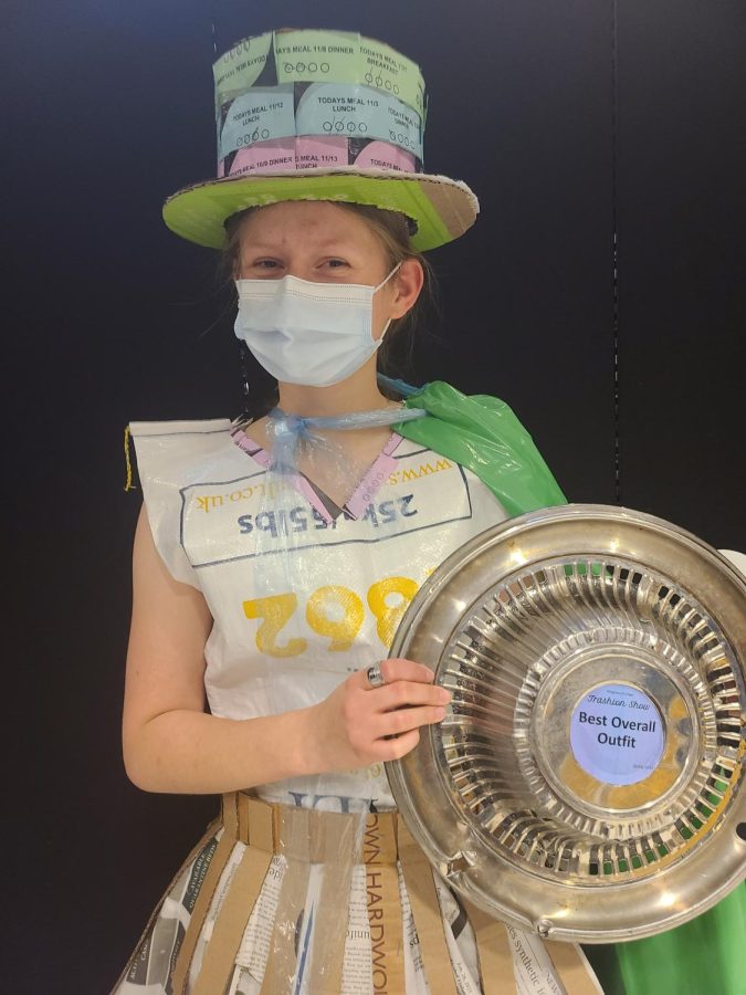 Elsa Waidelich, ’25, won “Best Overall Outfit” with her dress made out of recycled copies of The Campus.