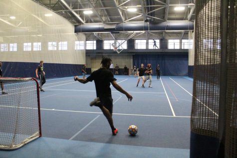 Sebastian Chisha, ’24, clears the ball in a goal kick during Gator Cup on the Blue Courts of the Wise Center. The Cup was the opening event of the African Students Association’s ‘ASA Week,’ which will run through Sunday, April 24.