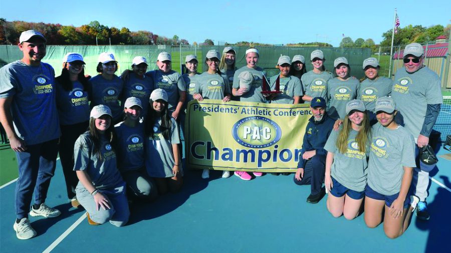 The+Allegheny+women%E2%80%99s+tennis+team+hoisting+the+championship+flag+after+defeating+Franciscan+5-4+at+the+Robertson+Athletic+Complex.