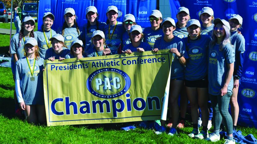 The Allegheny Women’s Cross Country team hoisting the championship flag after winning the Conference tournament on Saturday, Oct. 29. It was their first time winning back-to-back titles since their 3-peat during the 2015-17 seasons.