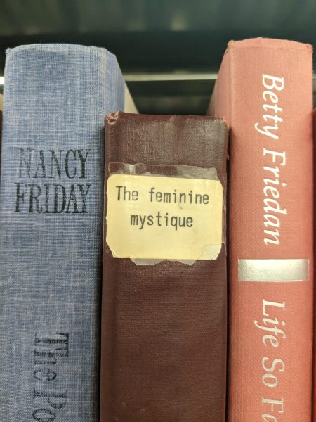 The Feminine Mystique, pictured in Pelletier Library, was published in 1963. It quickly became a symbol of the modern womens movement.