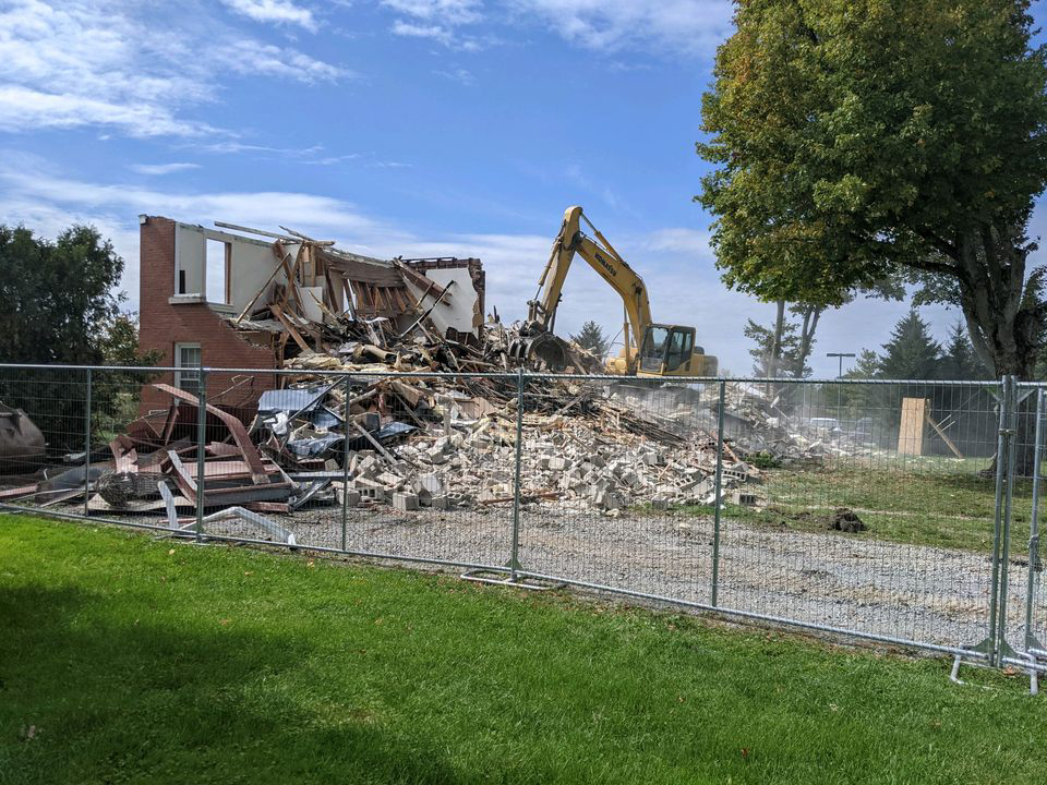 An excavator rolls across the rubble of Allegheny Hall on the afternoon of Wednesday, Sept. 27. The two-story dormitory is the second to be demolished this semester, after Caflisch Hall was torn down this August.