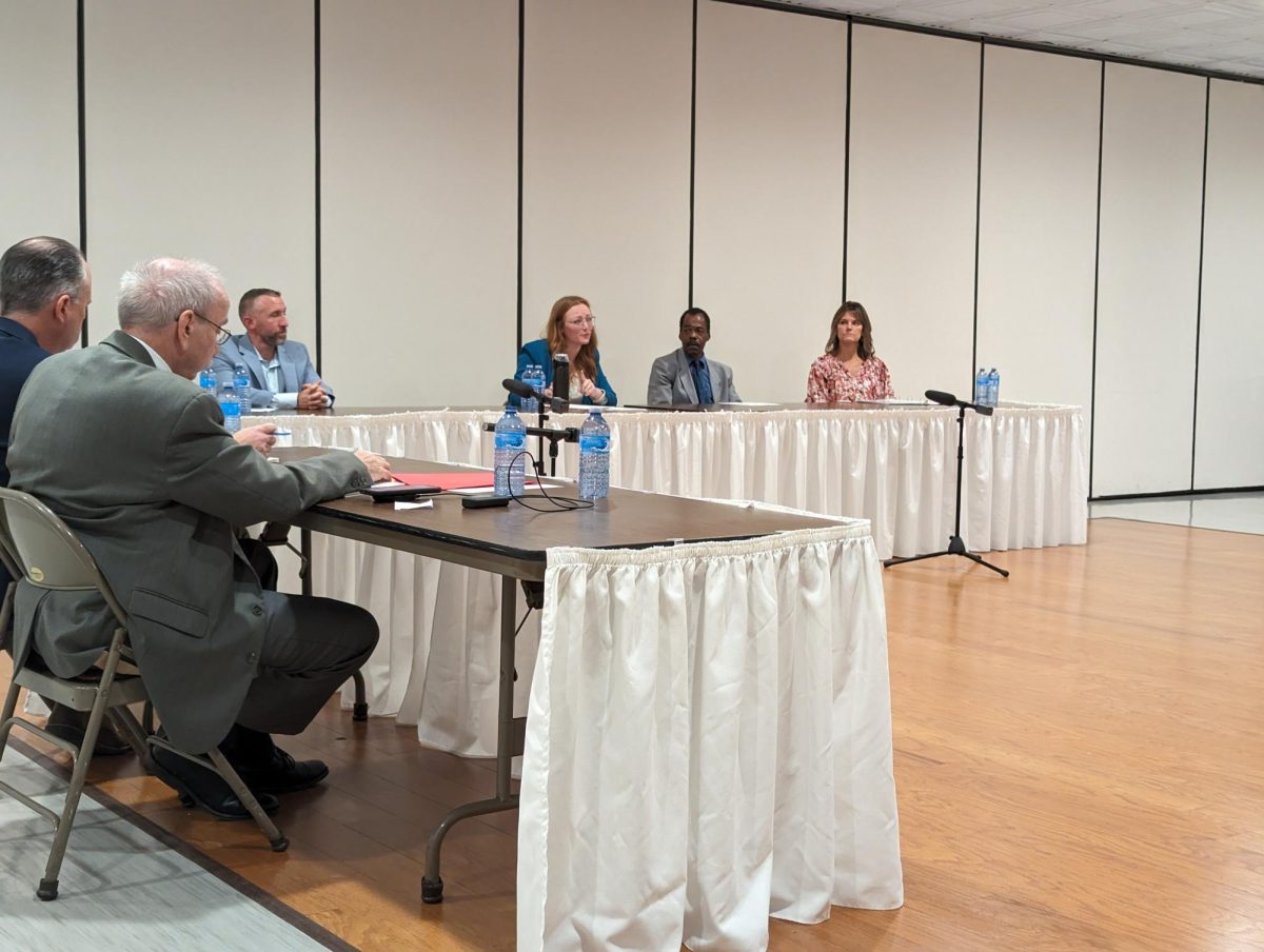 Moderators from the Meadville Tribune (left) lead a debate with the four candidates for Meadville City Council on Oct. 24. The candidates, from left: Bill Lawrence, Autumn Vogel, ’15, Larry McKnight and Marcy Kantz.