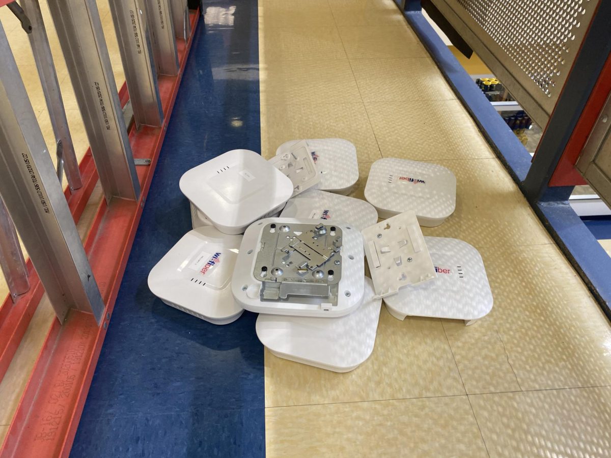 A pile of Wi-Fiber access points lay on the floor of the Henderson Campus Center on Nov. 2 after being removed to install new, better quality access points.