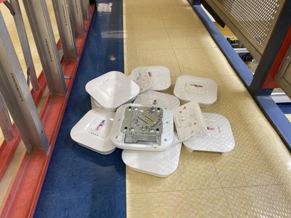 A pile of Wi-Fiber access points lay on the floor of the Henderson Campus Center on Nov. 2 after being removed to install new, better quality access points.