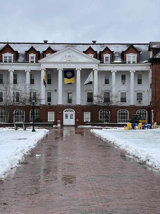Three banners hung up in August at the front of Brooks Hall to welcome the Class of 2027 blow in the strong winds during the week of Jan. 9.
