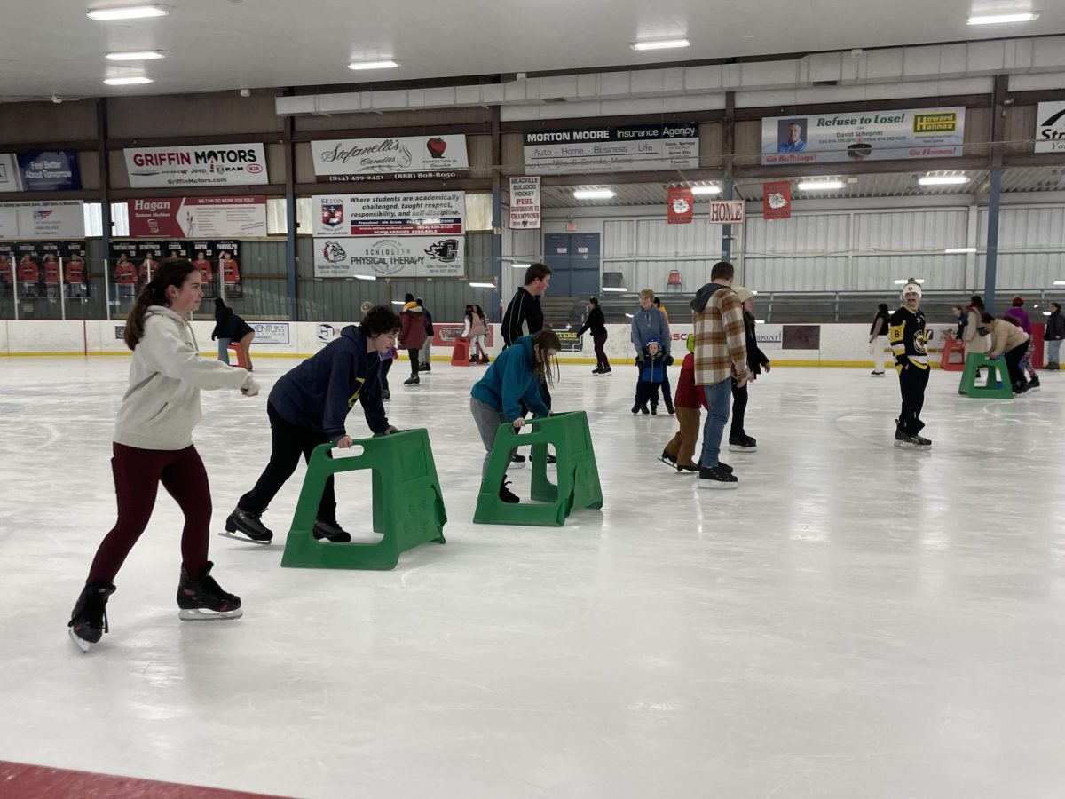 Allegheny students skate in a line at the Meadville Area Recreation Complex on the afternoon of Sunday, Feb. 4. Students could skate for free with their Allegheny ID, and rides from the college to the rink were also provided.