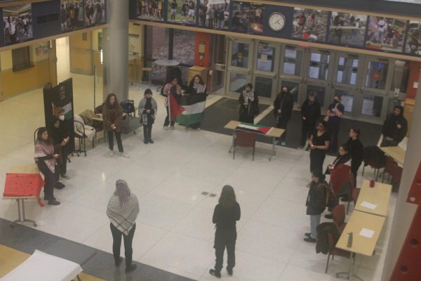 Students gather for a vigil for Palestine in the lobby of the Henderson Campus Center. The crowd peaked at about 30 attendees, with participants trickling in and out over the course of the event