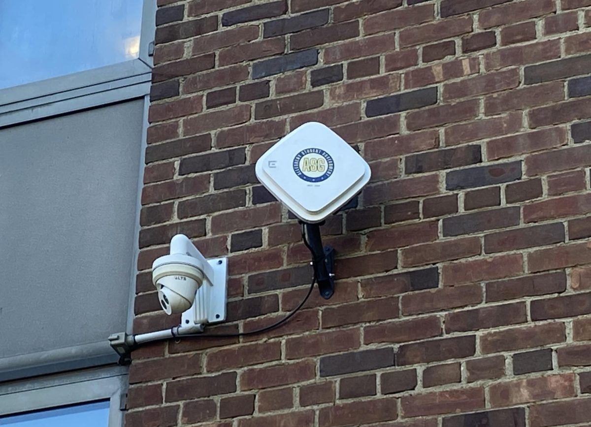 A Wi-Fi access point is mounted on an exterior wall of Baldwin Hall. Over the summer, the Information Technology team installed outdoor access points across campus to provide a Wi-Fi connection to students studying outside.