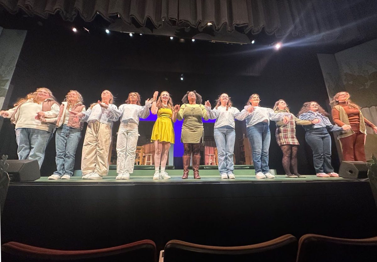 The cast of “Frog and Toad” take their final bow after the second night of the show in the Gladys Mullenix Black Theatre on Saturday, Nov. 9. Lucy Palmer, ’27, (center left) played the character Frog, and Niyah Moore, ’27, (center) played the character Toad.