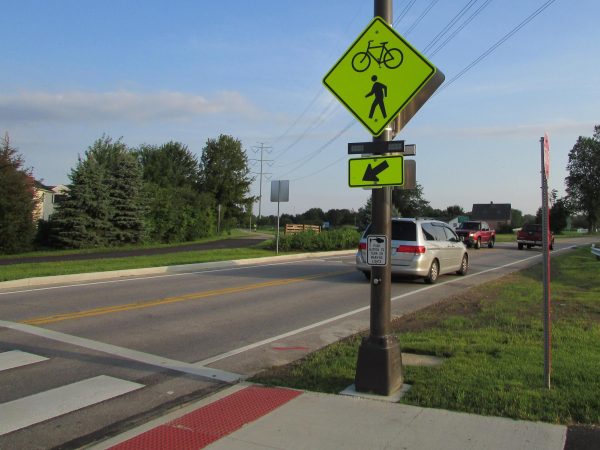 A Rectangular Rapid Flashing Beacon stands at a crosswalk in Hilliard, Ohio. For the past 18 months, Allegheny has been working with government authorities to install similar RRFBs at the North Main Street crosswalk between Baldwin Hall and the Henderson Campus Center.