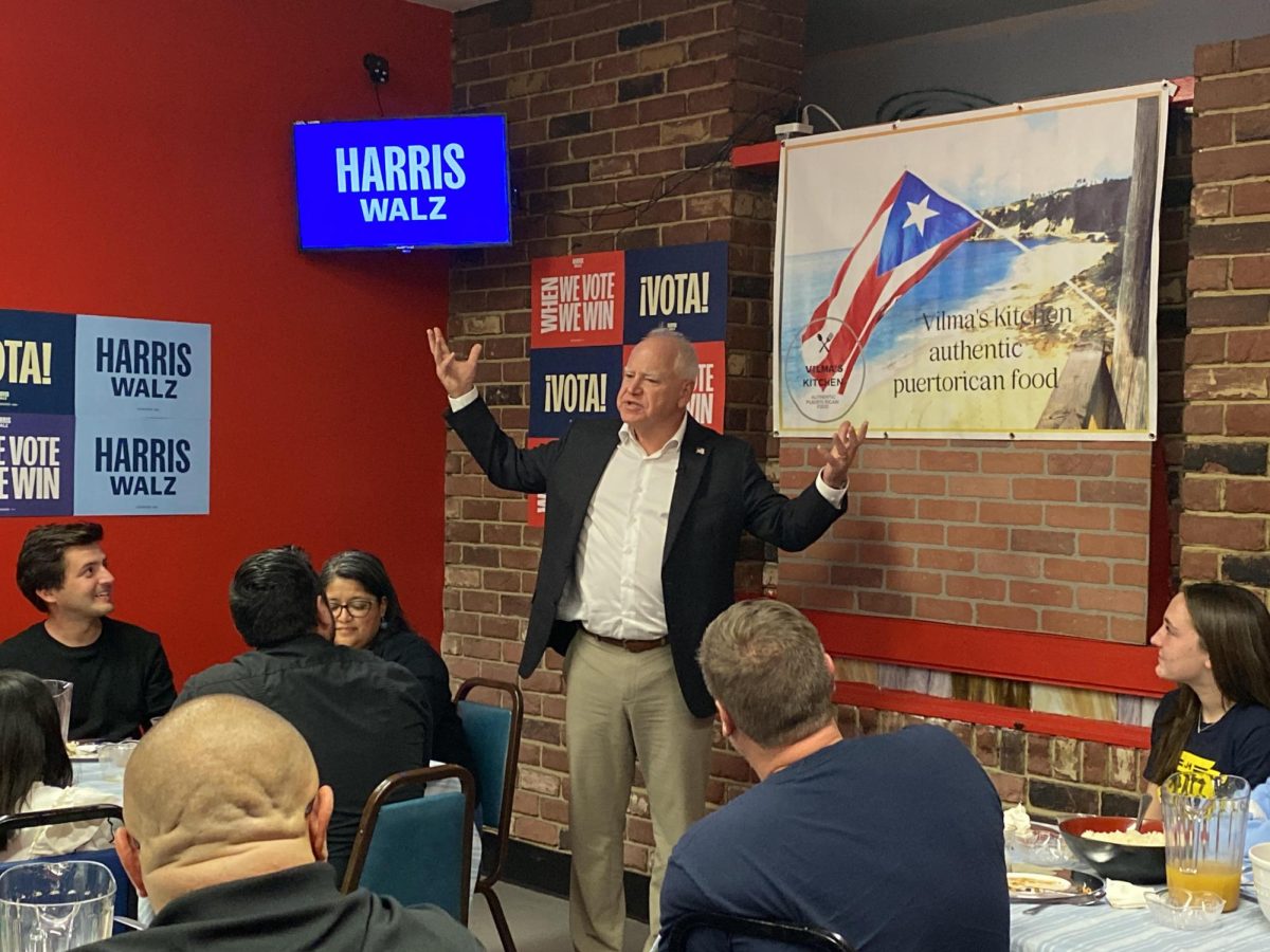 Walz addresses a small group of Erie residents at a campaign event in Vilma's Kitchen in Erie on Thursday, Oct. 31.