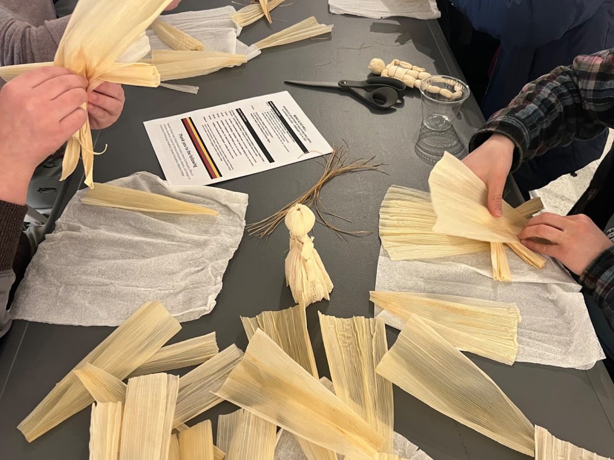 Participants learn how to make corn husk dolls from mother-daughter duo Antoinette Scott and Mary Denea.