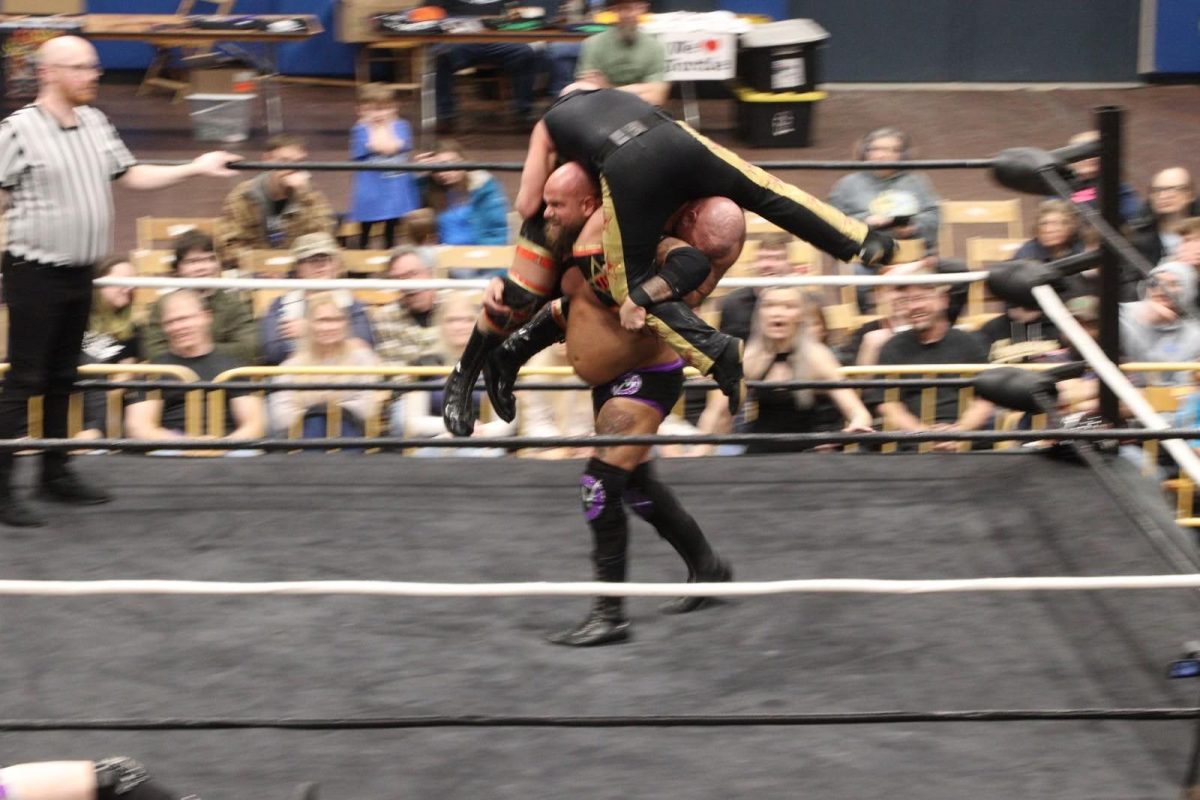 Vince Valor carries J-Rocc Daddy and Rex Brody during their tag team match at Ringside Redemption on March 8.