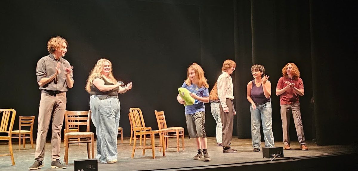 Nickel Spartz, ‘26, Syndey Mitrecic, ‘26, Aarron Rape, ’28, Jude Gotschall, ‘26, and Lukas Deemer, ‘28, act during The Playshop Theater’s production of “The Time Is Now,” on Friday, Sept. 19. In the center of the photo is the winner of the musical chairs game holding the Allegheny stuffed gator prize.
